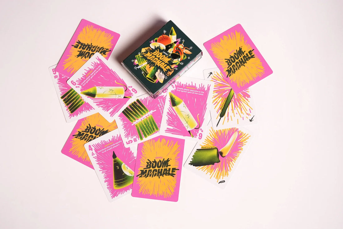 Boom Machale box and colourful cards arranged in a bright white flat lay