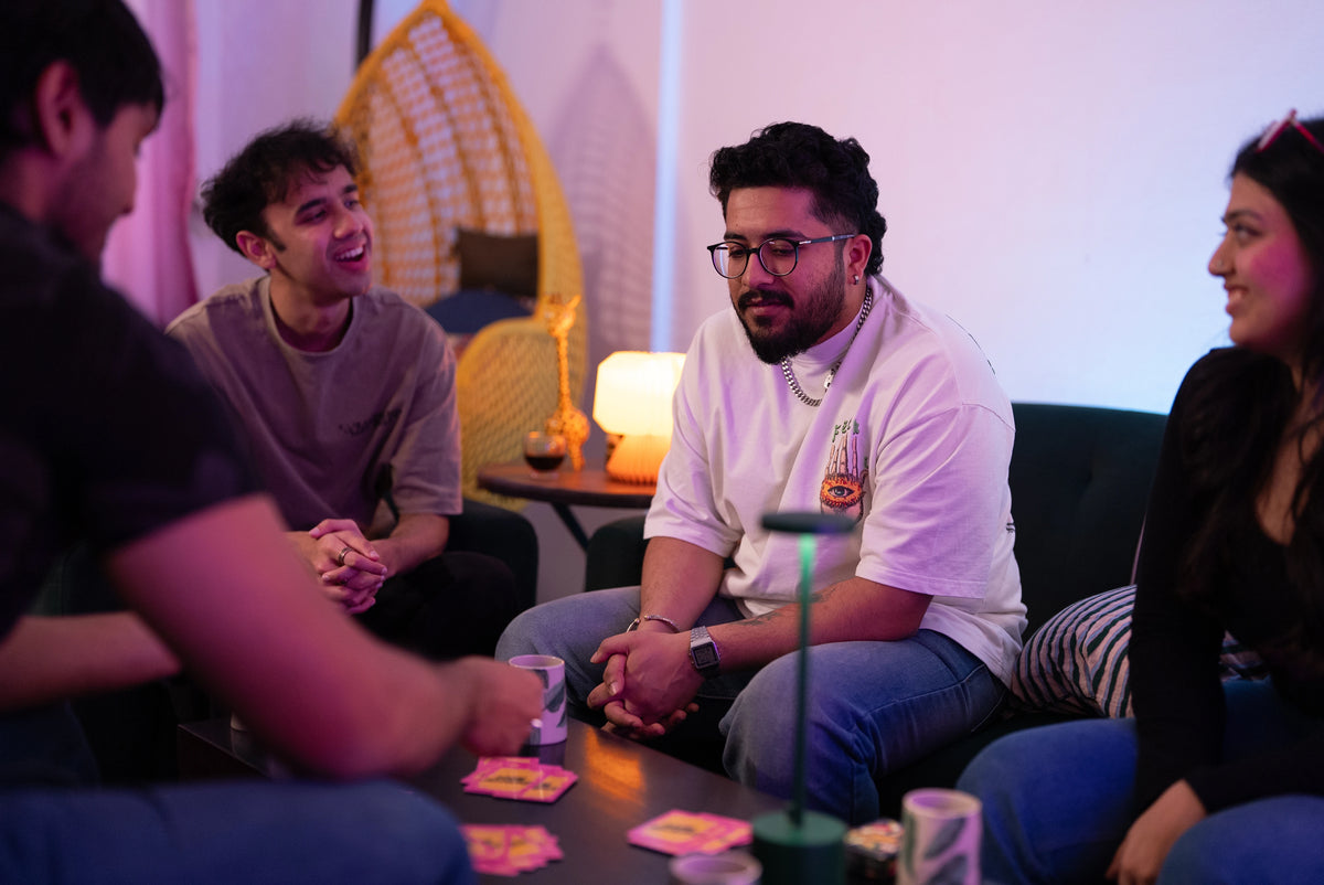Group of friends enjoying Boom Machale together at a house party