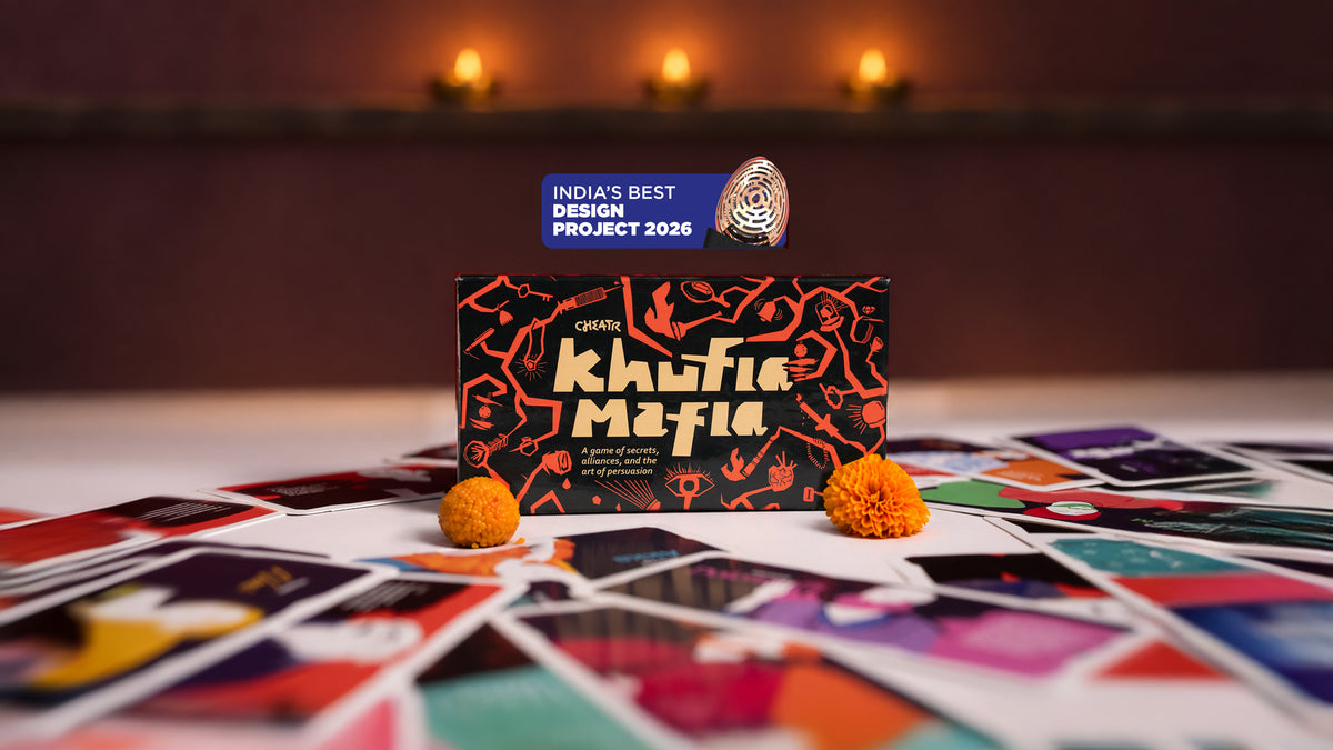 Khufia Mafia card game with motichoor ladoo, orange marigold and brass diyas